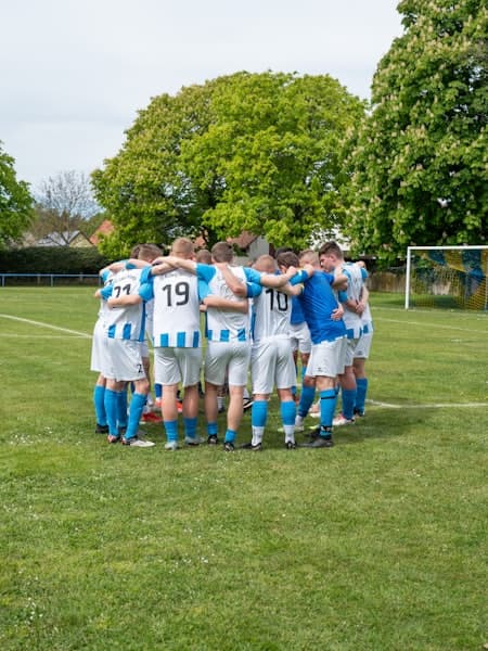 Team huddled together before kick-off