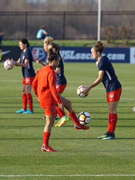 Two young players competing for the ball