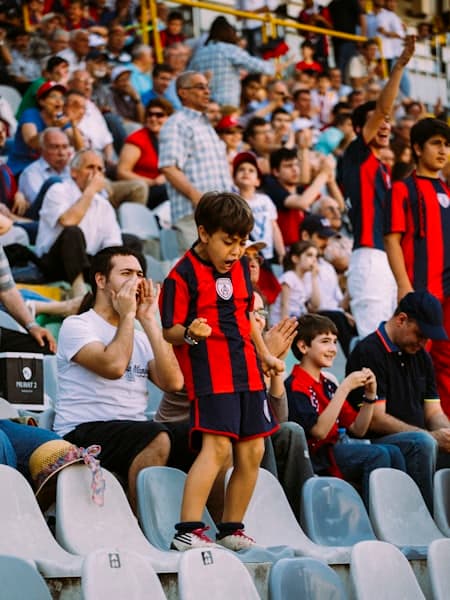 Supporters cheering from the stand