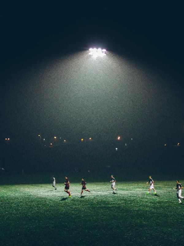 Floodlit night match seen from the stands
