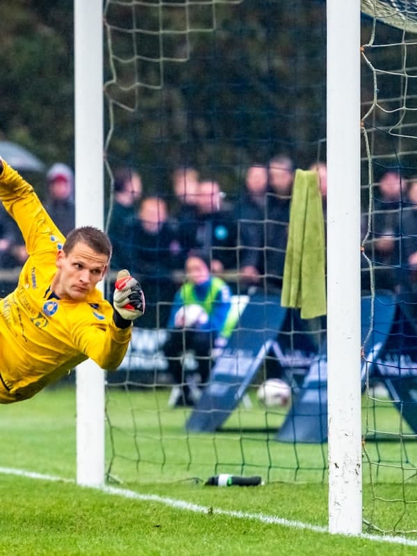 Goalkeeper diving to make a save