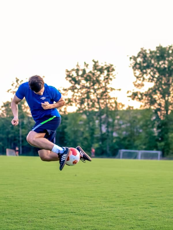 Player leaping for a mid-air volley