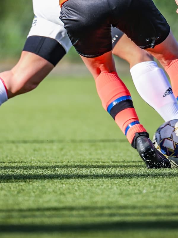 Two players challenging for the ball