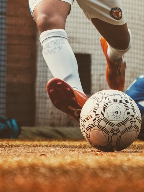 Close-up of a boot striking the ball