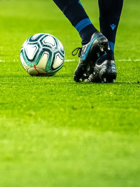 Close-up of a player shielding the ball