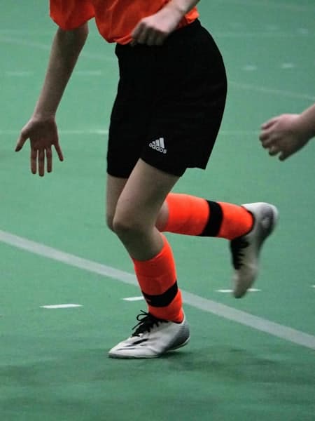 Player turning sharply on an indoor court